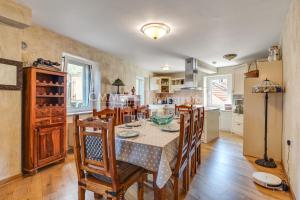 a kitchen and dining room with a table and chairs at Budva Old Town 3 bedroom Condo in Budva