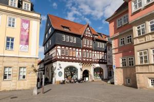a building with a black and white building at Apartment AM MARKT Eisenach in Eisenach