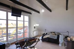 a bedroom with a bed and a large window at Spacious House In Skagen in Skagen +7 photos