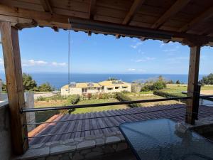 a view of the ocean from the porch of a house at Afytos sea view in Afitos