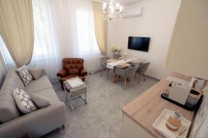 a living room with a couch and a table at Casa Mila in Belish