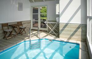 a swimming pool in the middle of a house at Lovely Home In Saltum in Saltum +31 photos