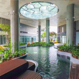 a large building with a pool in the middle at JiL JiL homestay in Trạm Chánh An