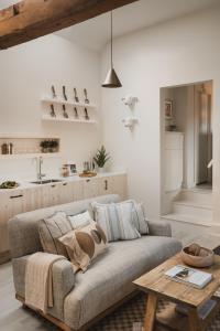 a living room with a couch and a table at Kennet in Marlborough