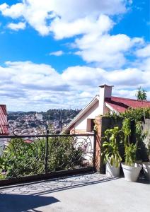a balcony with a view of a city at Soa Refuge in Antananarivo