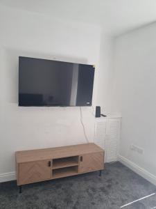 a large flat screen tv hanging on a wall at Waterloo apartment in Middlesbrough