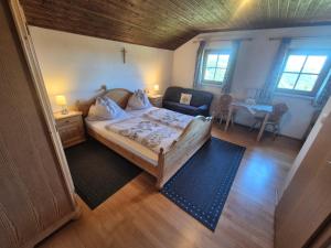an overhead view of a bedroom with a bed and a living room at Klein Schöntal in Göstling an der Ybbs