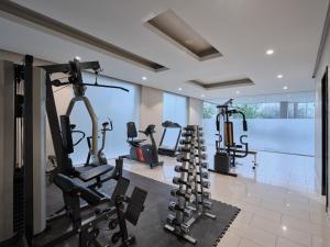 a gym with several tread machines in a room at Hamad - Salmiya -Family only in Kuwait