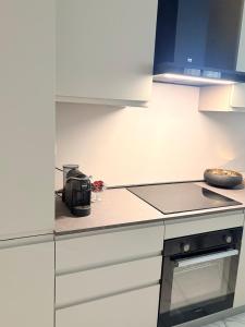 a kitchen with a stove and a counter top at Aura Suite in Parma
