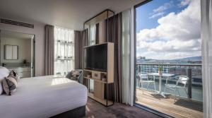 a hotel room with a bed and a large window at The Spencer Hotel in Dublin