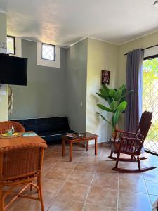 a living room with a couch and a table at CASA Angelo in Sosúa