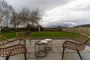 a group of chairs and a table on a patio at Kerry Hideaway - Killorglin in Killorglin