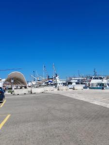 a parking lot with boats in a marina at Suite Crystal Home with Jacuzzi in Trapani