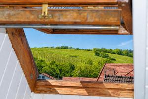 a wooden box with a view of a vineyard at Le Nid, Duplex lumineux proche Colmar in Soultz-Haut-Rhin