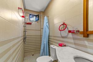a bathroom with a toilet and a shower at Riad Rêve D'Ourika in Ourika