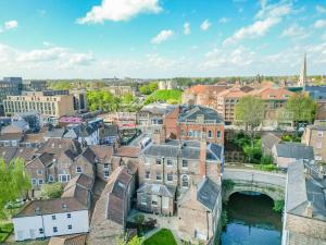 an aerial view of a city with a bridge at Walmgate Cottage in York