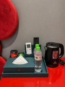 a tray with a bottle of water on a table at Hanora Boutique Hotel in Hanoi +37 photos