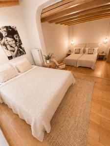 a large bedroom with two beds and a rug at Le Blanc in Dassia +39 photos