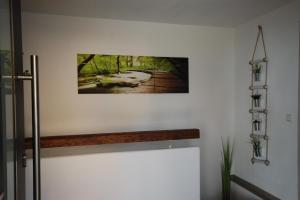 a picture hanging on a wall in a room at Haus Schambachtal in Treuchtlingen +39 photos