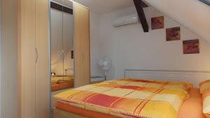 a bedroom with a bed and a dresser at Ferienwohnung Mohnblume in Gerswalde