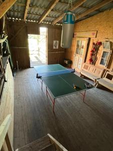 a ping pong table in the middle of a room at Chiemgauer Landliebe in Höslwang