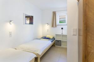 a bedroom with two beds and a window at Belvedere-Remise in Weimar