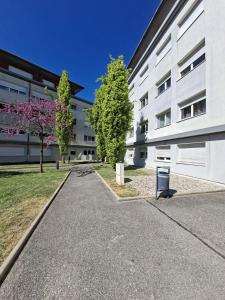 an empty street in front of a building at Le 540 - Annecy - Parking in Annecy