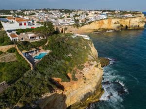 an aerial view of a beach and the ocean at Refugio in Carvoeiro