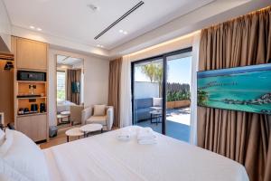 a hotel room with a bed and a large window at Hotel Teuta in Sarandë +281 photos