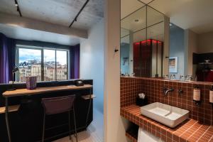 a bathroom with a sink and a mirror at mk2 Hotel Paradiso Nation in Paris +23 photos