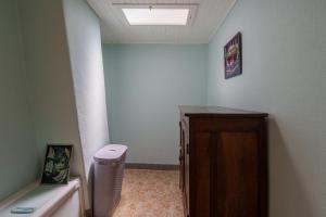 a hallway with a room with a ceiling with a window at Maison T2 - Le Boichot in Dole