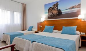 Postel nebo postele na pokoji v ubytování Hotel Verol