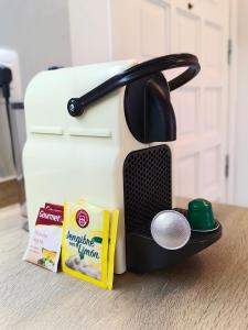 a toaster sitting on a counter with a box of food at Cozy & Terrace Apartament5 in Los Cristianos