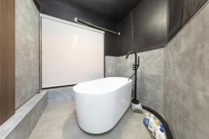 a bathroom with a white toilet in a room at Nagoya JADE GRACE in Nagoya