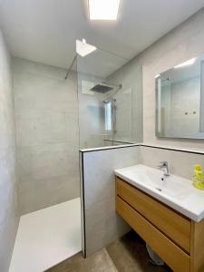 a bathroom with a sink and a shower at Pension Waldheim in Mauterndorf +40 photos