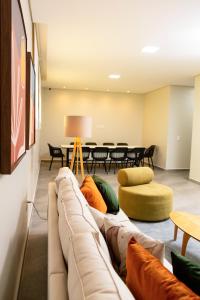 a living room with a couch and a table at Picos Hotel in Picos