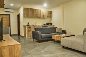 a living room with a couch and a table at Venue 360 Hotel in Freetown