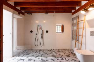 a bathroom with a shower and a toilet at New! Villa Can Marsoch in Santa Eularia des Riu +28 photos
