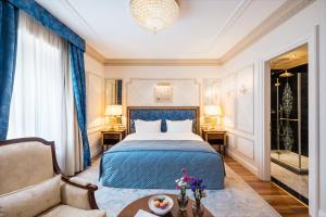 a hotel room with a bed and a couch at Hotel Flüela Davos - The Unbound Collection by Hyatt in Davos +53 photos
