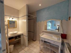 a bathroom with a sink and a mirror at Le Clos des 4 Saisons in La Rochepot +20 photos