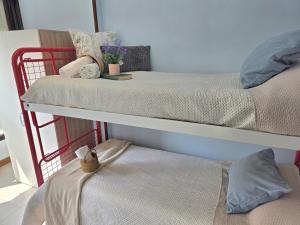 two bunk beds in a room with at Apartamento Candela 6904 in Noja +7 photos