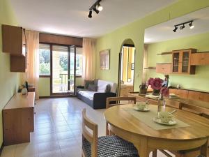a living room with a table and a couch at Apartamento Candela 6904 in Noja