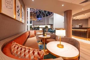 a waiting room with chairs and a table at Crowne Plaza Liverpool City Centre by IHG in Liverpool