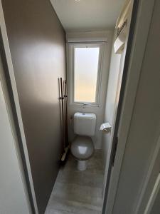 a small bathroom with a toilet and a window at Luberon Detente Mobile Home in Cheval-Blanc +21 photos