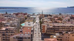 an aerial view of a city with the ocean at Rina Sea Apartments in Alghero
