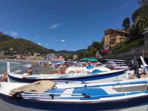 a group of boats docked at a beach at Casa Bruna in Levanto