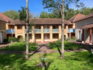 an exterior view of a house with trees at Lake view Appartment in Monflanquin