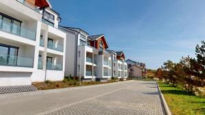 a row of apartment buildings on a street at DaVinci Apartments VRT in Cristian