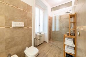 a bathroom with a toilet and a shower at Palazzo Rivola in Bergamo +87 photos
