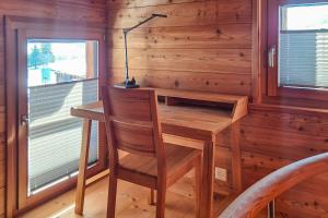 a wooden desk and chair in a room with a window at Stadel de Riedmatten in Reckingen - Gluringen +7 photos
